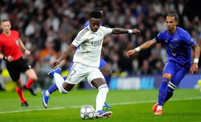 Real Madrid's Vinicius Junior scores his side's fifth goal during the Champions League opening phase soccer match between Real Madrid and Monaco in Madrid on Tuesday, Jan. 20, 2026. (AP Photo/Jose Breton)
