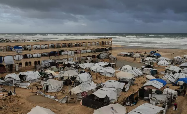 A view of a displacement camp sheltering Palestinians on a beach amid stormy weather in Gaza City, Tuesday, Jan. 13, 2026. (AP Photo/Jehad Alshrafi)
