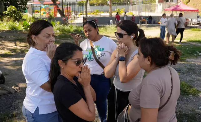 Relatives of political prisoners gather outside the Rodeo I prison in Guatire, Venezuela, Thursday, Jan. 8, 2026, after National Assembly President Jorge Rodriguez said the government would release Venezuelan and foreign prisoners. (AP Photo/Matias Delacroix)
