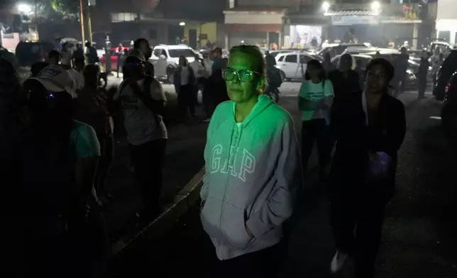 Mariana Gonzalez, the daughter of former presidential candidate Edmundo Gonzalez, stands outside the Rodeo I prison where her husband is detained, in Guatire, Venezuela, Thursday, Jan. 8, 2025, after National Assembly President Jorge Rodriguez said the government would release Venezuelan and foreign prisoners. (AP Photo/Matias Delacroix)