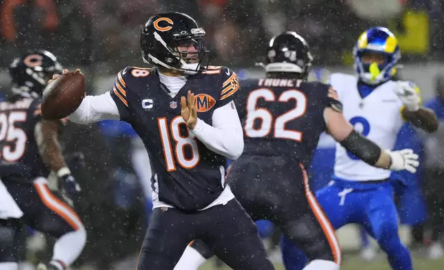 Chicago Bears quarterback Caleb Williams throws a pass against the Los Angeles Rams during the first half of an NFL football divisional playoff game Sunday, Jan. 18, 2026, in Chicago. (AP Photo/Nam Y. Huh)