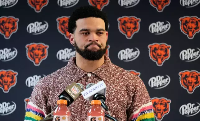 Chicago Bears quarterback Caleb Williams talks to reporters following his team's overtime loss to the Los Angeles Rams during an NFL football divisional playoff game Sunday, Jan. 18, 2026, in Chicago. (AP Photo/Nam Y. Huh)