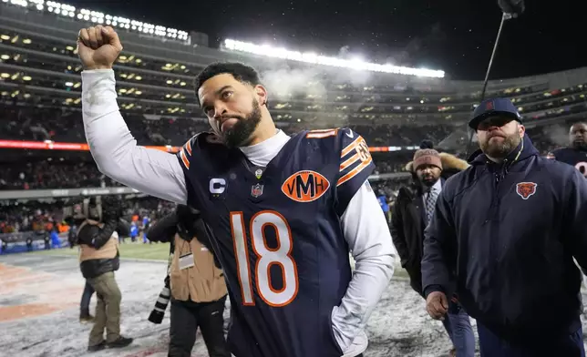 Chicago Bears quarterback Caleb Williams gestures as he leaves the field following his team's overtime loss to the Los Angeles Rams during an NFL football divisional playoff game Sunday, Jan. 18, 2026, in Chicago. (AP Photo/Nam Y. Huh)