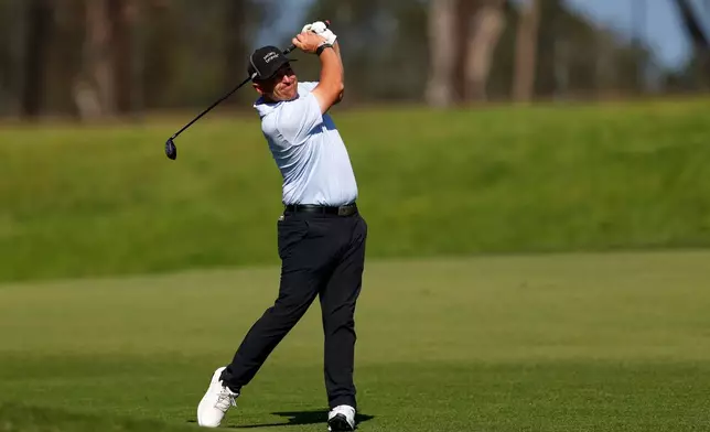 Justin Lower hits from the fairway on the ninth hole on the North Course at Torrey Pines during the first round of the Farmers Insurance Open golf tournament Thursday, Jan. 29, 2026, in San Diego. (AP Photo/Caroline Brehman)