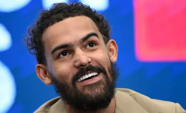 Washington Wizards newly acquired point guard Trae Young answers a question at news conference before an NBA basketball game against the New Orleans Pelicans, Friday, Jan. 9, 2026, in Washington. (AP Photo/John McDonnell)