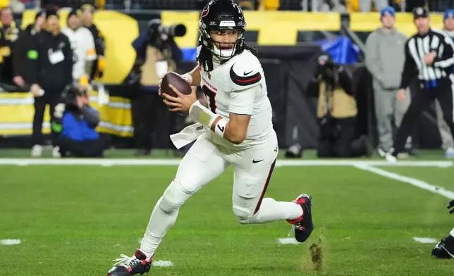 Houston Texans quarterback C.J. Stroud looks for a receiver during the first half of NFL wild-card playoff football game against the Pittsburgh Steelers, Monday, Jan. 12, 2026, in Pittsburgh. (AP Photo/Gene J. Puskar)