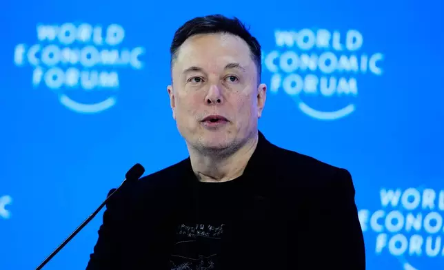 Elon Musk attends the Annual Meeting of the World Economic Forum in Davos, Switzerland, Thursday, Jan. 22, 2026. (AP Photo/Markus Schreiber)