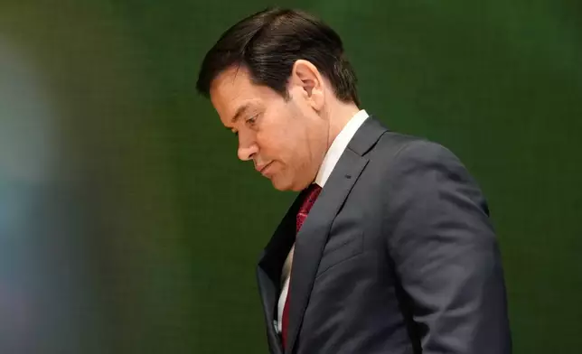 United States Secretary of State Marco Rubio walks down stairs after a meeting during the Annual Meeting of the World Economic Forum in Davos, Switzerland, Wednesday, Jan. 21, 2026. (AP Photo/Markus Schreiber)