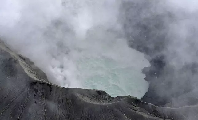 The area of Mount Aso is seen in Kumamoto Prefecture, southwestern Japan, Tuesday, Jan. 20, 2026, where a sightseeing helicopter went missing earlier in the day.(Kyodo News via AP)
