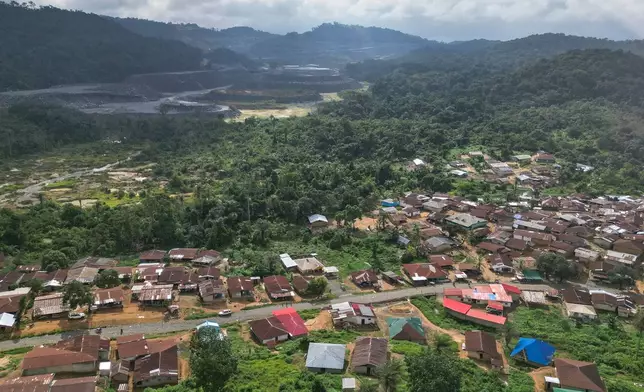 An aerial view shows Bea Mountain's N'dablama mine site and Gold Camp Community, Liberia, July 8, 2025. (AP Photo/Misper Apawu)