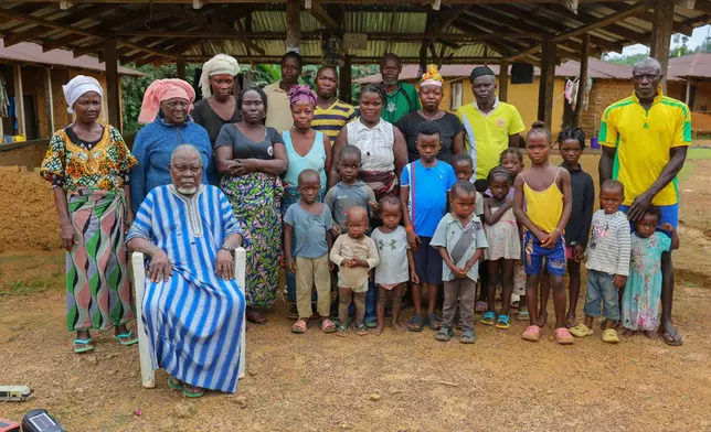 Residents are preparing to relocate from their village after the river they depend on was poisoned by mining waste in Jikando, Liberia, July 8, 2025. (AP Photo/Misper Apawu)