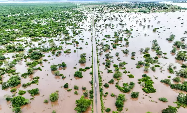 Flood waters cover the Chibuto-Chaimite road in Gaza province, Mozambique, Saturday, Jan. 17, 2026. (AP Photo)