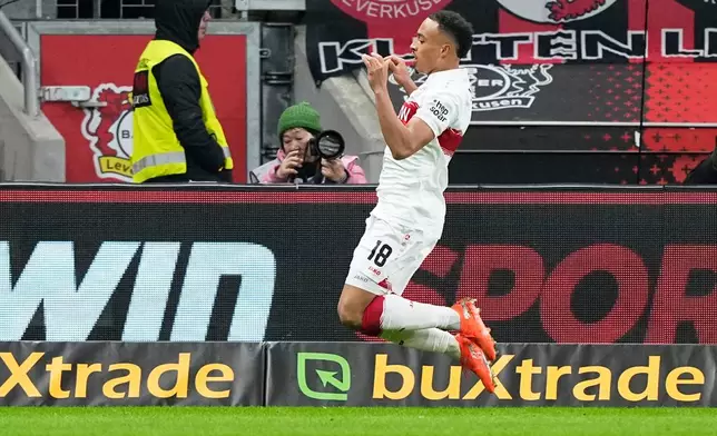 Stuttgart's Jamie Leweling celebrates after scoring his side's opening goal during the German Bundesliga soccer match between Bayer 04 Leverkusen and VfB Stuttgart in Leverkusen, Germany, Saturday, Jan. 10, 2026. (AP Photo/Martin Meissner)