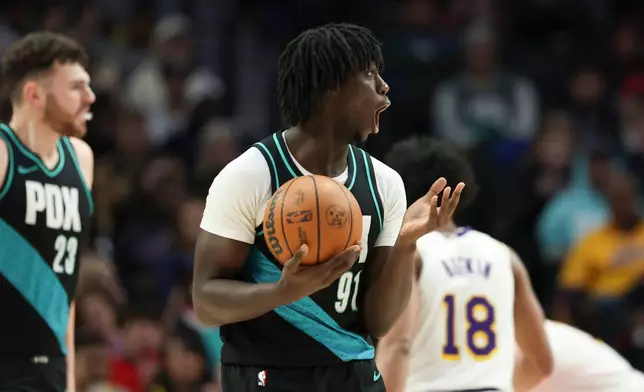 Portland Trail Blazers guard Sidy Cissoko (91) reacts after a call during the first half of an NBA basketball game against the Los Angeles Lakers Saturday, Jan. 17, 2026, in Portland, Ore. (AP Photo/Amanda Loman)