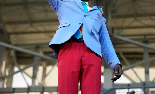 Michel Nkuka Mboladinga, a DR Congo fan impersonating late Congolese leader Patrice Lumumba poses before the Africa Cup of Nations round of 16 soccer match between Algeria and DR Congo in Rabat, Morocco, Tuesday, Jan. 6, 2026. (AP Photo/Mosa'ab Elshamy)