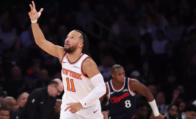 New York Knicks guard Jalen Brunson (11) gestures after scoring a 3-point basket against the LA Clippers during the first half of an NBA basketball game, Wednesday, Jan. 7, 2026, in New York. (AP Photo/Heather Khalifa)