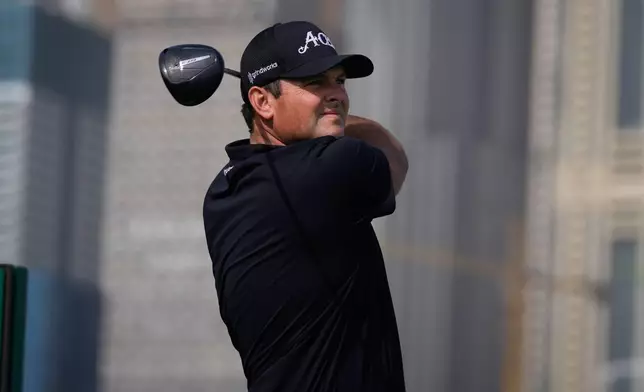 Patrick Reed of the United States watches the ball after teeing off at first hole during second round of the Dubai Desert Classic in United Arab Emirates, Friday, Jan. 23, 2026. (AP Photo/Altaf Qadri)