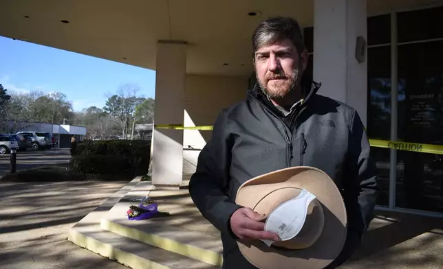 Beth Israel Congregation President Zach Shemper stands for a portrait in front of the synagogue's closed entrance on Tuesday, Jan. 13, 2026, in Jackson, Miss. (AP Photo/Sophie Bates)