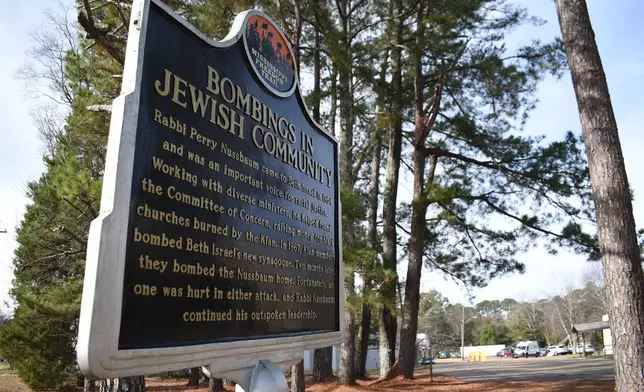 A sign describing when the synagogue was bombed by the Ku Klux Klan in 1967 stands outside the Beth Israel Congregation on Monday, Jan. 12, 2026, in Jackson, Miss. (AP Photo/Sophie Bates)