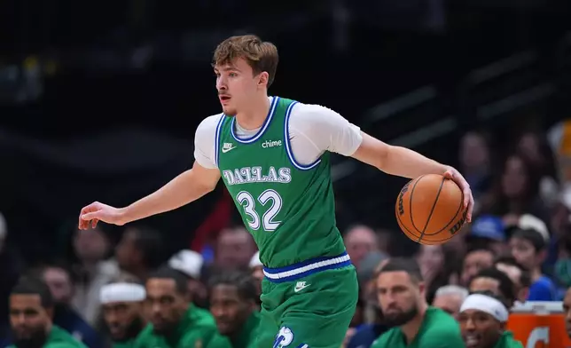 Dallas Mavericks forward Cooper Flagg works the floor against the Los Angeles Lakers during the first half of an NBA basketball game Saturday, Jan. 24, 2026, in Dallas. (AP Photo/Julio Cortez)