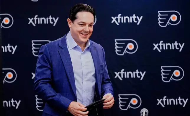 FILE - Philadelphia Flyers NHL hockey team Special Assistant to the General Manager Daniel Briere arrives for a news conference in Philadelphia, Wednesday, Feb. 9, 2022. (AP Photo/Matt Rourke, File)