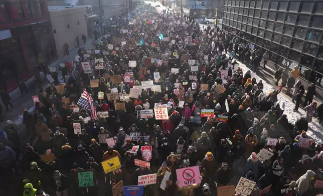 EDS NOTE: OBSCENITY - People protest against ICE (Immigration and Customs Enforcement) in downtown Minneapolis, Sunday, Jan. 25, 2026. (AP Photo/Adam Gray)