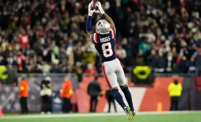 New England Patriots wide receiver Stefon Diggs catches a pass during the second half of an NFL football game against the Miami Dolphins in Foxborough, Mass., Sunday, Jan. 4, 2026. (AP Photo/Robert F. Bukaty)