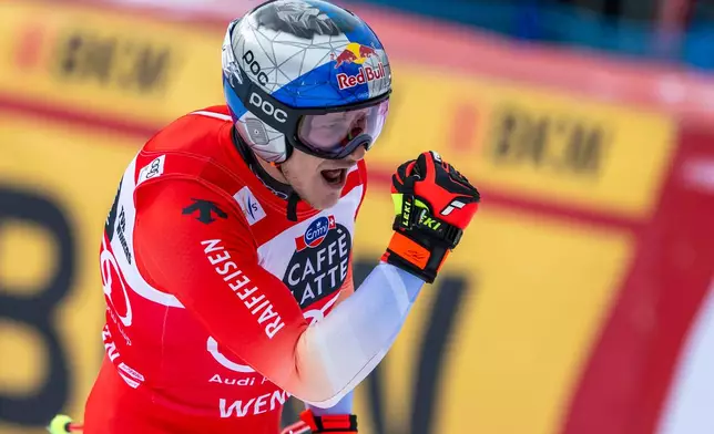 Switzerland's Marco Odermatt reacts in the finish area during an alpine ski, men's World Cup downhill race, in Wengen, Switzerland, Saturday, Jan. 17, 2026. (Peter Schneider/Keystone via AP)