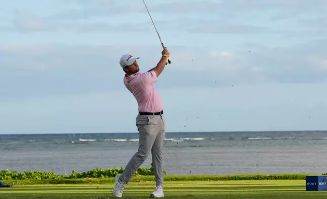 Davis Riley hits on the 17th hole during the third round of the Sony Open golf event at the Waialae Country Club in Honolulu, Saturday, Jan. 17, 2026. (AP Photo/Matt York)