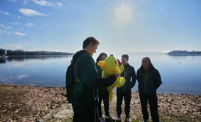 Australia's Winter Olympics team athletes stand at the AIS European Training Centre in Gavirate, on the Varese lake, northern Italy, Monday, Jan. 26, 2026. (AP Photo/Antonio Calanni)