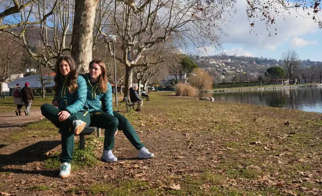 Australia's Breeana Walker, left, and Kiara Reddingius sit at the AIS European Training Centre in Gavirate, on the Varese lake, northern Italy, Monday, Jan. 26, 2026. (AP Photo/Antonio Calanni)
