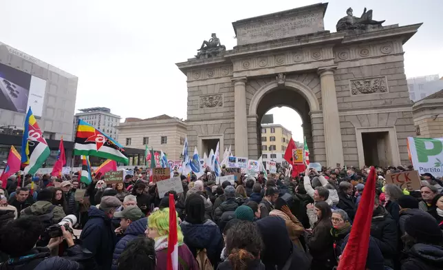 People take part in an Anti-ICE demonstration, ahead of the 2026 Winter Olympics, in Milan, Italy, Saturday, Jan. 31, 2026. (AP Photo/Antonio Calanni)