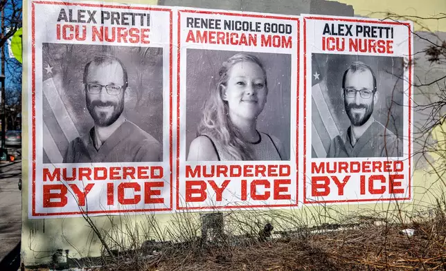 Posters depicting Alex Pretti and Renee Nicole Good are displayed on a wall near the site where Pretti, a 37-year-old ICU nurse, was fatally shot by federal immigration agents, in Minneapolis, Minn., Thursday, Jan. 29, 2026. (Kerem Yücel/Minnesota Public Radio via AP)