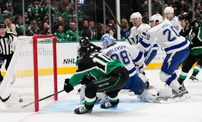 Dallas Stars center Oskar Back (10) scores as Tampa Bay Lightning goaltender Andrei Vasilevskiy (88) defends the net in the first period of an NHL hockey game in Dallas, Sunday, Jan. 18, 2026. (AP Photo/Tony Gutierrez)