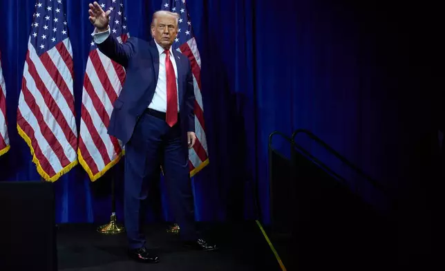 President Donald Trump waves as he walks off stage after speaking to House Republican lawmakers during their annual policy retreat, Tuesday, Jan. 6, 2026, in Washington. (AP Photo/Evan Vucci)