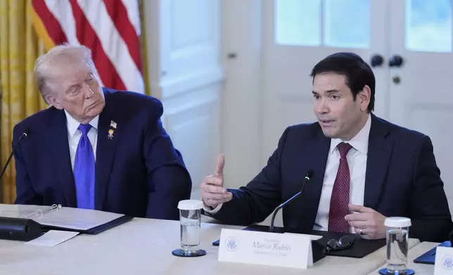 President Donald Trump listens to Sec. of State Marco Rubio speak during a meeting with oil executives in the East Room of the White House, Friday, Jan. 9, 2026, in Washington. (AP Photo/Alex Brandon)