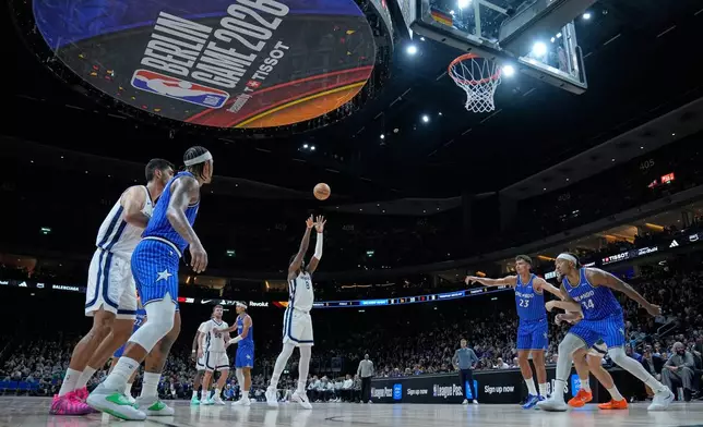 Memphis Grizzlies forward Jaren Jackson Jr. (8) shoots during an NBA basketball game between Orlando Magic and Memphis Grizzlies in Berlin, Germany, Thursday, Jan. 15, 2026. (AP Photo/Ebrahim Noroozi)