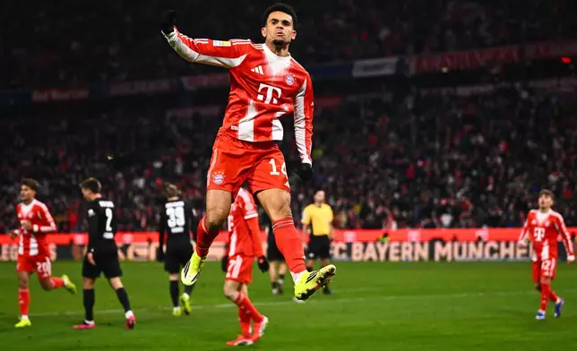 Munich's Luis Diaz celebrates scoring during the Bundesliga soccer match between Bayern Munich and VfL Wolfsburg in Munich, Germany, Sunday Jan. 11, 2026. (Tom Weller/dpa via AP)