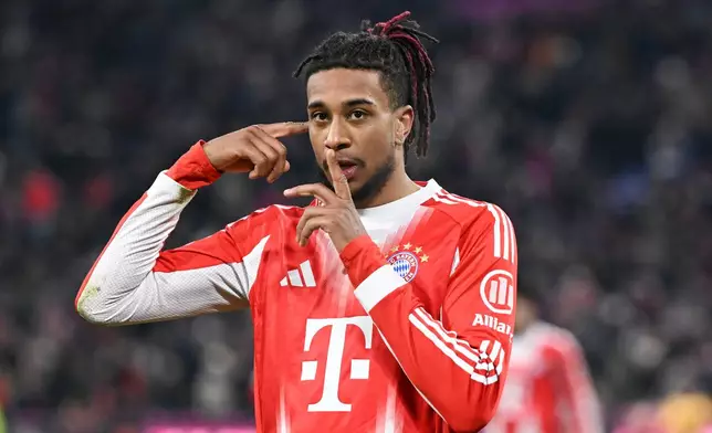 Munich's Michael Olise celebrates scoring during the Bundesliga soccer match between Bayern Munich and VfL Wolfsburg in Munich, Germany, Sunday Jan. 11, 2026. (Sven Hoppe/dpa via AP)