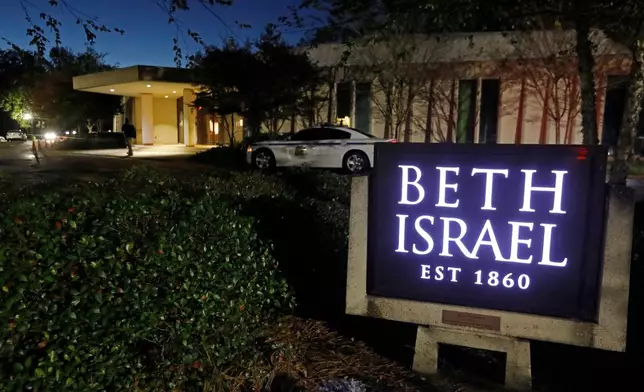 FILE - This Nov. 2, 2018 photo shows an armed Hinds County Sheriff's deputy outside of the Beth Israel Congregation synagogue in Jackson, Miss. (AP Photo/Rogelio V. Solis, file)