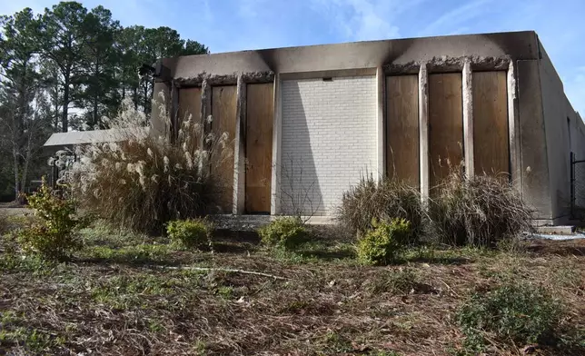 /// Boards cover the charred remains of the Beth Israel Congregation library, which was set on fire early Saturday morning, on Monday, Jan. 12, 2026, in Jackson, Mississippi. (AP Photo / Sophie Bates)