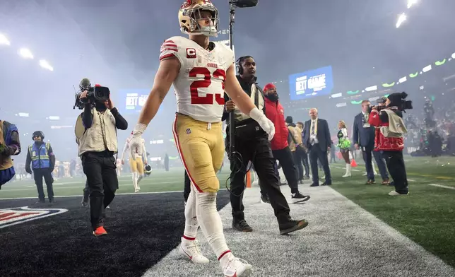 San Francisco 49ers' Christian McCaffrey walks off the field after an NFL football divisional playoff game against the Seattle Seahawks, Saturday, Jan. 17, 2026, in Seattle. (Scott Strazzante/San Francisco Chronicle via AP)