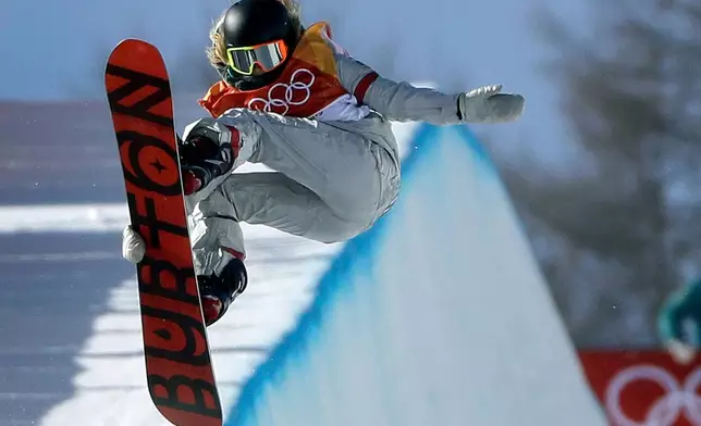 FILE - Chloe Kim, of the United States, jumps during the women's halfpipe finals at Phoenix Snow Park at the 2018 Winter Olympics in Pyeongchang, South Korea, on Feb. 13, 2018. (AP Photo/Gregory Bull, File)