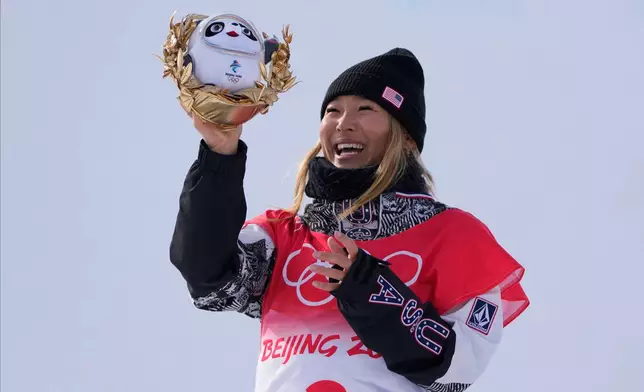 FILE - Gold medal winner Chloe Kim, of the United States, celebrates during the venue ceremony for the women's halfpipe at the 2022 Winter Olympics, Feb. 10, 2022, in Zhangjiakou, China. (AP Photo/Lee Jin-man, File)