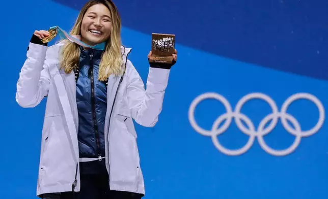 FILE - Women's halfpipe gold medalist Chloe Kim, of the United States, poses during the medals ceremony at the 2018 Winter Olympics in Pyeongchang, South Korea, on Feb. 13, 2018. (AP Photo/Morry Gash, File)