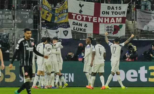 Tottenham's players celebrate their side's opening goal during the Champions League opening phase soccer match between Eintracht Frankfurt and Tottenham Hotspurs in Frankfurt, Germany, Wednesday, January. 28, 2026. (AP Photo/Michael Probst)