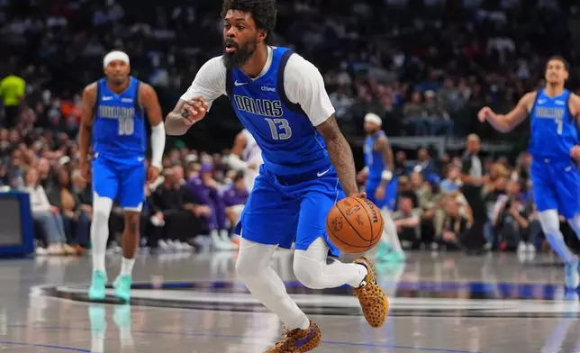 Dallas Mavericks forward Naji Marshall (13) dribbles during the second half of an NBA basketball game against the Utah Jazz in Dallas, Thursday, Jan. 15, 2026. (AP Photo/LM Otero)