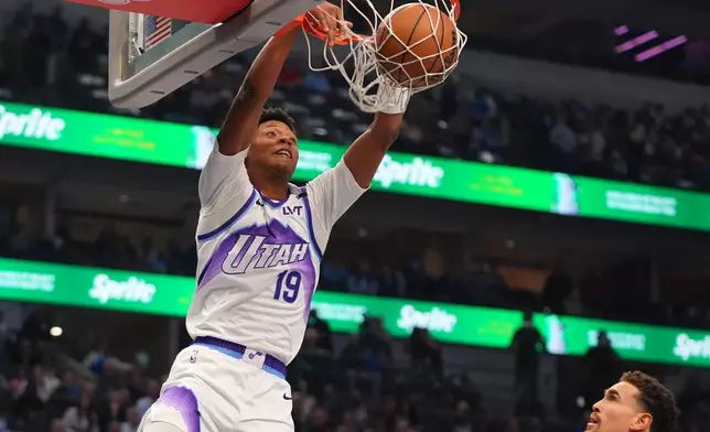 Utah Jazz guard Ace Bailey slam dunks during the first half of an NBA basketball game against the Dallas Mavericks in Dallas, Thursday, Jan. 15, 2026. (AP Photo/LM Otero)