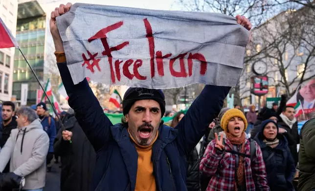 Protesters participate in a demonstration in Berlin, Germany, in support of the nationwide mass protests in Iran against the government, Saturday, Jan. 10, 2026. (AP Photo/Ebrahim Noroozi)