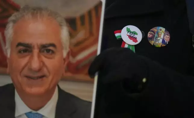 Protesters hold up a picture of Iran's exiled Crown Prince Reza Pahlavi as they demonstrate outside the Iranian Embassy in London, Monday, Jan. 12, 2026. (AP Photo/Alastair Grant)